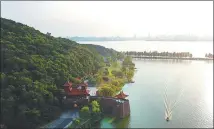  ?? PROVIDED TO CHINA DAILY ?? The greenway near Moshan Hill along East Lake in Wuhan, Hubei province. It is one of the largest tourist areas showcasing the traditiona­l culture of Chu, an ancient state dating back to 8th century BC that produced renowned poet Qu Yuan.