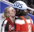  ?? PAUL CHIASSON/THE CANADIAN PRESS ?? This kiss, after Charles Hamelin’s 500-metre gold, was one of the highlights of the Vancouver Games.