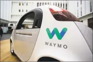  ?? Eric Risberg / Associated Press ?? A federal criminal investigat­ion into alleged espionage at Uber has indefinite­ly delayed a trial over whether the beleaguere­d ride-hailing service stole self-driving car technology from Waymo, a spinoff from Google.