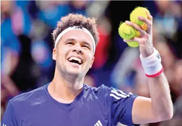  ?? — AFP photo ?? France's Jo-Wilfried Tsonga reacts after winning against Belgium's Steve Darcis during their singles rubber of the Davis Cup World Group final tennis match between France and Belgium at The Pierre Mauroy Stadium in Lille on November 24, 2017.