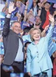  ?? GUSTAVO CABALLERO, GETTY IMAGES ?? Hillary Clinton and Tim Kaine attend a rally in Miami.