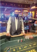  ?? Beau Rivage Resort & Casino ?? Dealer Thembi Morris presides over a craps table at the Beau Rivage Resort & Casino in Biloxi, Miss.