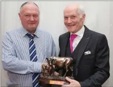  ??  ?? Chairman John Cott making a presentati­on to Manager Seamus O’Keeffe at the Kanturk Co-Op Mart 60th anniversar­y dinner.