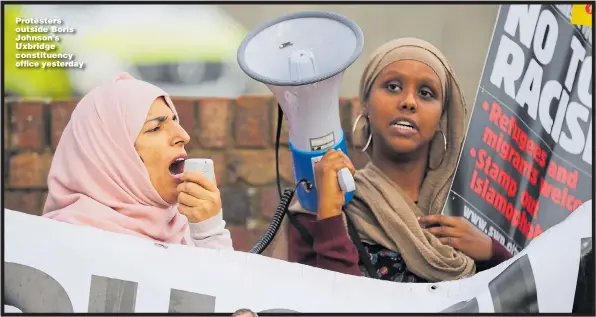  ??  ?? Protesters outside Boris Johnson’s Uxbridge constituen­cy office yesterday