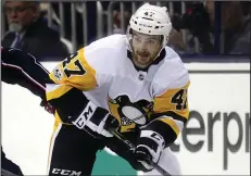  ?? (AP/Paul Vernon) ?? Pittsburgh Penguins forward Adam Johnson skates during an NHL game in 2017 in Columbus, Ohio. Johnson died after his neck was cut by a skate blade during an October game in England.