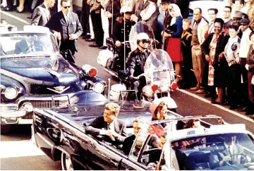  ??  ?? Kennedy, First Lady Jaqueline Kennedy and Texas Governor John Connally ride in a liousine moments before Kennedy was assassinat­ed, in Dallas,Texas.