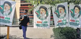  ?? REUTERS ?? Banners of presidenti­al candidate Ebrahim Raisi are seen on a street in Tehran.