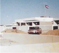  ??  ?? Ghaleb Farha with his employees outside the constructi­on site of Sheikh Rashid Hospital in 1971; the villa where he lived in Abu Dhabi in 1969 and his villa on Al Wasl Road, Jumeirah, in 1976. —