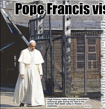  ?? REUTERS ?? Pope Francis walks through Auschwitz’s notorious gate during his visit to the former Nazi death camp in Poland yesterday.