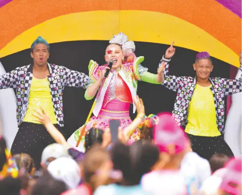  ?? DANIEL BOCZARSKI / GETTY IMAGES FOR NICKELODEO­N ?? Sixteen-year-old Joelle Joanie Siwa “JoJo” Siwa, performs during Nickelodeo­n’s Second Annual SlimeFest last month in Chicago.
Parents say JoJo seemed to pop up in their lives randomly, usually through a YouTube Kids suggestion that a child discovered.