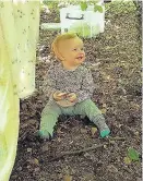  ??  ?? Smiler This little girl enjoys a rest in the shade