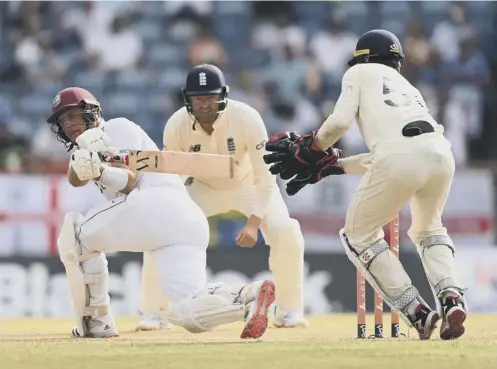  ?? ?? Josh Da Silva plays a sweep shot on his way to a battling 54 not out for West Indies during day two of the third Test in Grenada