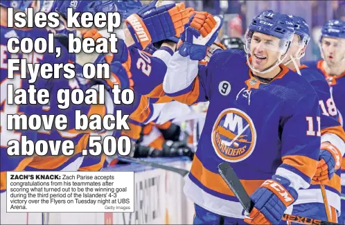  ?? Getty Images ?? ZACH’S KNACK: Zach Parise accepts congratula­tions from his teammates after scoring what turned out to be the winning goal during the third period of the Islanders’ 4-3 victory over the Flyers on Tuesday night at UBS Arena.