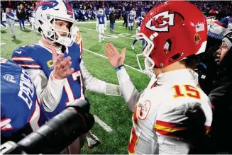  ?? Jeffrey T. Barnes/Associated Press ?? Buffalo Bills quarterbac­k Josh Allen (17) greets Kansas City Chiefs quarterbac­k Patrick Mahomes after playing in an AFC divisional playoff game Sunday in Orchard Park, N.Y.