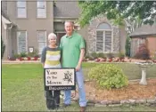  ??  ?? Daphne and Cary Bawcum, 6848 Briarfield Lane, received the Briarwood Yard of the Month Award for May. The Bawcums also received a $ 25 gift card from Leader Credit Union in Bartlett.