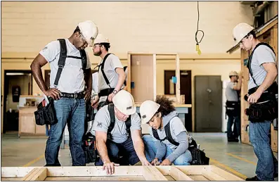  ?? JULIA FENNER/Leggybird Photograph­y/The Home Depot via AP ?? Students gain carpentry experience at a training session sponsored by The Home Depot Foundation the and Home Builders Institute this spring in Fort Stewart, Ga. The U.S. constructi­on industry will need an additional 747,000 workers by 2026, the U.S. Bureau of Labor Statistics says.