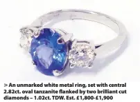  ??  ?? An unmarked white metal ring, set with central 2.82ct. oval tanzanite flanked by two brilliant cut diamonds – 1.02ct. TDW. Est. £1,800-£1,900