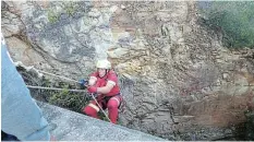  ?? Picture: SUPPLIED ?? CAREFUL DESCENT: Warrant Officer Etienne Gerber abseils off the 216m-high Bloukrans Bridge to search for and retrieve the body of a man who committed suicide by jumping off it.