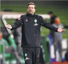  ?? Stuart Franklin / Associated Press ?? Florian Kohfeldt, head coach of Werder Bremen reacts during a match against Bayer Leverkusen on Monday.