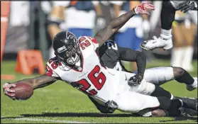  ?? THEARON W. HENDERSON / GETTY IMAGES ?? Running back Tevin Coleman has rushed for 110 yards and four touchdowns in three games, including this one in a 35-28 victory over the Raiders on Sept. 18.