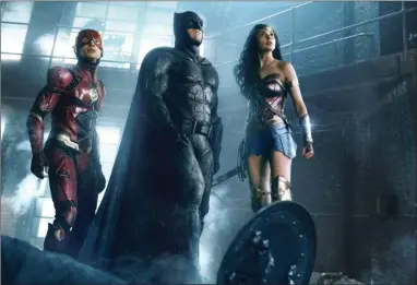  ?? AP PHOTO BY WARNER BROS. ENTERTAINM­ENT INC. ?? This image released by Warner Bros. Pictures shows Ezra Miller, from left, Ben Affleck and Gal Gadot in a scene from “Justice League.”