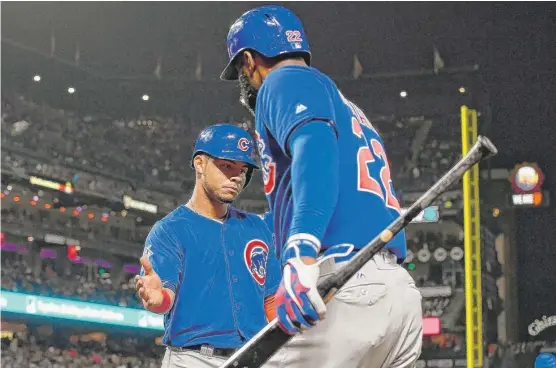  ?? | THEARONW. HENDERSON/ GETTY IMAGES ?? Willson Contreras ( left) hopes to be back before the end of the regular season but says he won’t return until he’s sure he can play at “120 percent.”