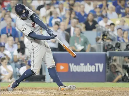  ?? DAVID J. PHILLIP/THE ASSOCIATED PRESS ?? George Springer capped a World Series game to remember Wednesday with the fifth homer in extra innings.