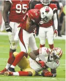  ?? Norm Hall / Getty Images ?? Arizona’s Rashad Johnson stands over the 49ers’ Carlos Hyde.