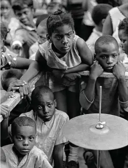  ?? William Sauro / New York Times ?? Children listen to Tony Lawrence’s band on June 27, 1967, at the Harlem Cultural Festival in New York.