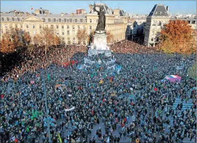  ?? (AFP) ?? Demonstrat­ors gather on the Place de la Republique in Paris on Saturday.