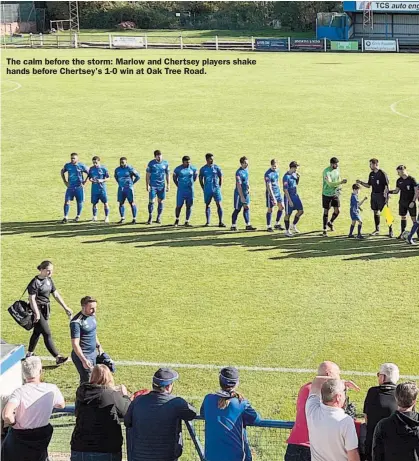  ?? ?? The calm before the storm: Marlow and Chertsey players shake hands before Chertsey's 1-0 win at Oak Tree Road.