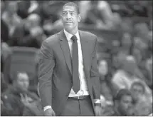  ?? Jessica Hill Associated Press ?? KEVIN OLLIE, who was fired Saturday as basketball coach at Connecticu­t, was in the second year of a five-year deal.