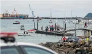  ??  ?? Teiron Jones’ boat is towed into Port Taranaki.