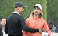  ?? Getty Images file ?? Pep Guardiola reacts with Tommy Fleetwood during the Pro Am for the BMW PGA Championsh­ip. —