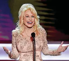  ?? [PHOTO BY CHRIS PIZZELLO, INVISION/ AP FILE] ?? Dolly Parton presents the Lifetime Achievemen­t Award on Jan. 29, 2017, at the 23rd annual Screen Actors Guild Awards at the Shrine Auditorium &amp; Expo Hall in Los Angeles.