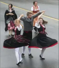  ?? MATHEW MCCARTHY PHOTOS, RECORD STAFF ?? Dancers perform during the Oktoberfes­t Thanksgivi­ng Day Parade.