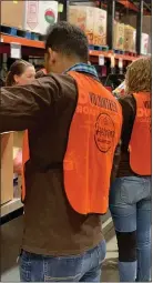  ?? COURTESY OF DUNKIN’ BRANDS ?? Representa­tives of area Dunkin’ coffee and doughnut shops volunteere­d Thursday at Helping Harvest Food Bank in Spring Township. The food bank serves more than 100,000 people in Berks and Schuylkill counties