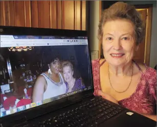  ?? Photo by Ernest A. Brown ?? Sylvia Bartholomy, of Woonsocket, is pleased and looking forward to the screening of a French Canadian immigratio­n video at American-French Geneologic­al Society this Sunday in Woonsocket. On the screen is a picture of Sylvia and her friend, Anna...