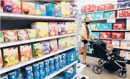  ?? FREDERIC J. BROWN/GETTY-AFP ?? Baby products are displayed Thursday at a Target in Hollywood, Calif. Gender neutral toy aisles could become compulsory in California department stores.