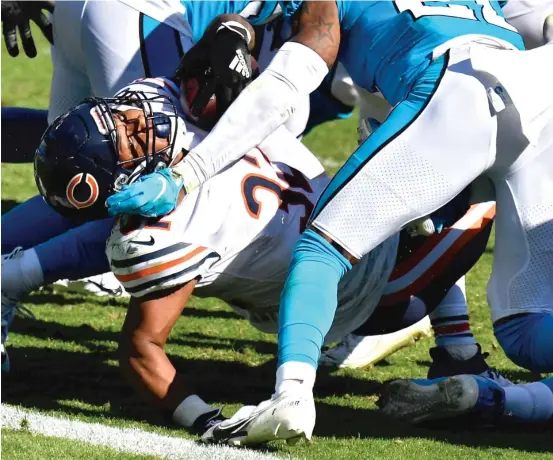  ?? GETTY IMAGES ?? David Montgomery gained 58 yards on 19 carries against the Panthers on Sunday. The Bears’ lackluster rushing attack averaged just 2.52 yards per carry in the game.