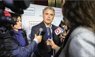  ?? NICOLO FILIPPO ROSSO/BLOOMBERG ?? Ivan Duque, a candidate for president of Colombia, is seen as free of scandal. Recent polls show he has about 40 percent support, compared with about 30 percent for his closest rival, the leftist former mayor of Bogota, Gustavo Petro. The first round...
