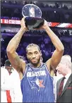 ??  ?? Kawhi Leonard of the Los Angeles Clippers holds up his NBA All-Star Game Kobe Bryant MVP Award after the NBA All-Star basketball game on Feb 16 in Chicago. (AP)