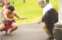  ?? (Perry Trotter) ?? MAORI TRIBESMEN perform a haka for new Israeli Ambassador to New Zealand Ran Yaakoby (right).