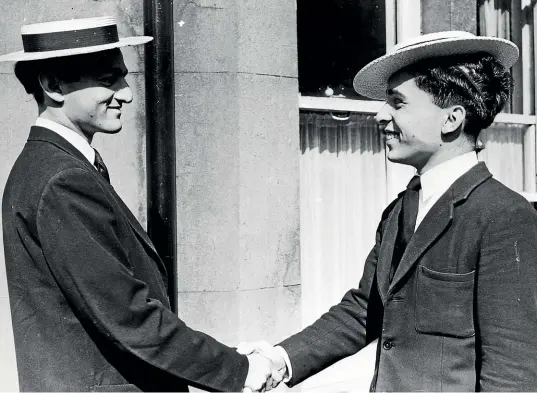  ?? GETTY IMAGES ?? Prince Mukarram Jah, left, in 1952, welcoming Crown Prince Hussein of Jordan back to school at Harrow.