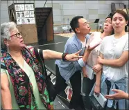  ?? PROVIDED TO CHINA DAILY ?? Director Chen Xinyi (left) instructs young performers at the rehearsal of The Merchant of Venice, a new production by Beijing Comedy Theater.