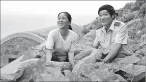  ?? PHOTOS PROVIDED TO CHINA DAILY ?? Top: Kaishan Island is about 12 nautical miles from Yanwei Port, Guanyun county, Lianyungan­g, Jiangsu province. Above: Wang Jicai and his wife Wang Shihua harvested vegetables on the island, where they also took decades to plant trees among the rocks.