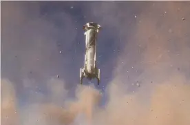  ?? ZUMA Wire/REX/Shuttersto­ck ?? Booster rocket lands automatica­lly and safely back to earth. Photograph: Blue Origin/