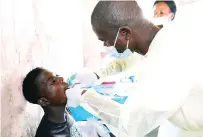  ?? ?? Dentists attend to patients during a Angel of Hope Foundation free medical outreach organised by Health and Child Care Ambassador First Lady Dr Auxillia Mnangagwa in Kanyemba recently. — Pictures: John Manzongo