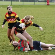  ?? Pic: ?? Sligo’s Cria Flanagan is tackled around the ankles, supported by Amy Hampson. Jean McConnell.