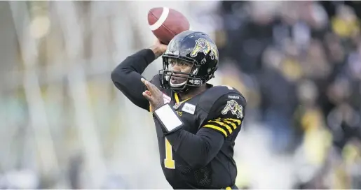  ?? Frank Gun / THE CANADIAN PRESS ?? Hamilton Tiger-Cats quarterbac­k Henry Burris throws down field during a game against the Montreal Alouettes on Nov. 10.